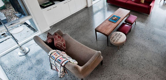 The image shows a living area with nice polished concrete floor.