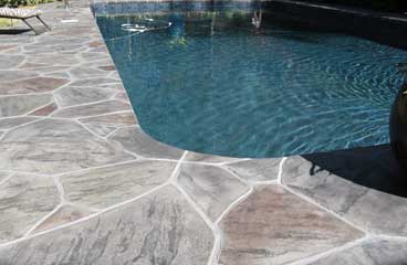 This image shows a pool deck that was newly resurfaced.